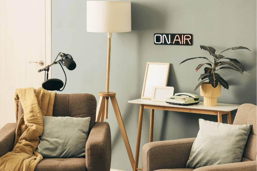 Two chairs and a microphone, as pictured on The Room She Built website